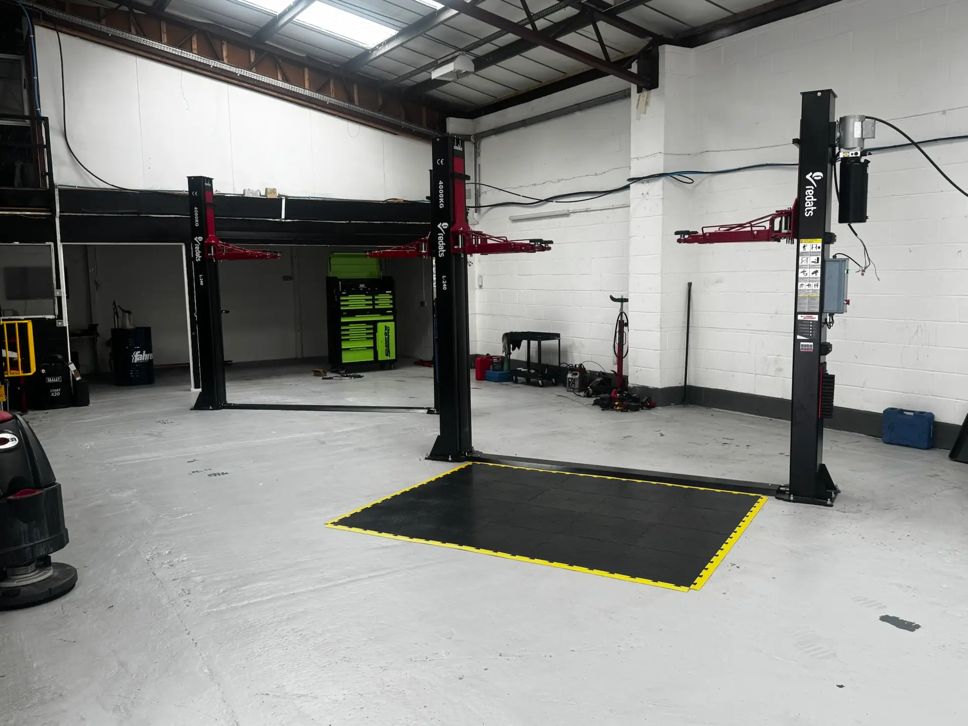 Two-post vehicle lifts in the Enviro Repair workshop, Royston