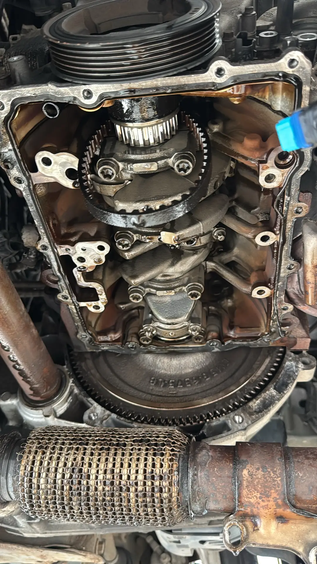 Engine sump removed during a Ford 1.0 EcoBoost wet belt replacement
